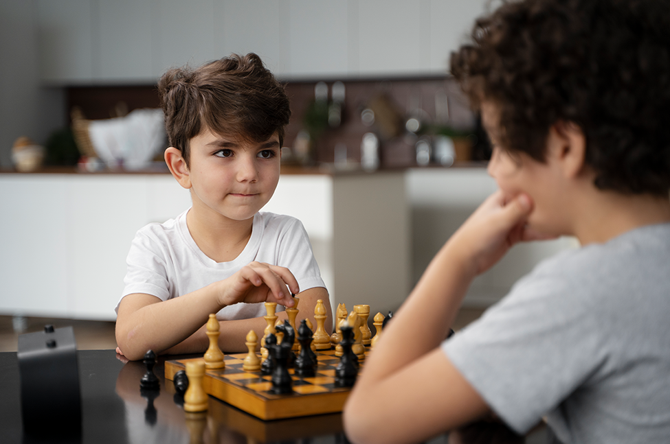 Parent and Kid Playing Chess